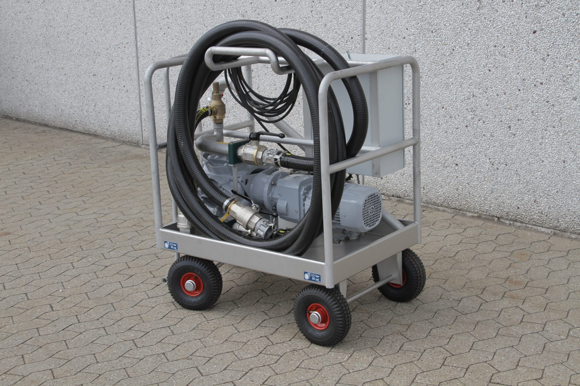 Mobile cart with a motor and hoses, designed for transporting equipment.
